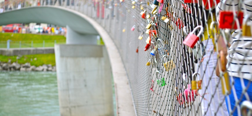 The Students observe the love locks placed on the Markarsteg Bridge in Salzburg Austria.
